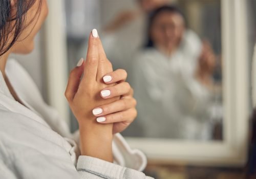 beautiful-hand-of-woman-with-white-manicure-.jpg